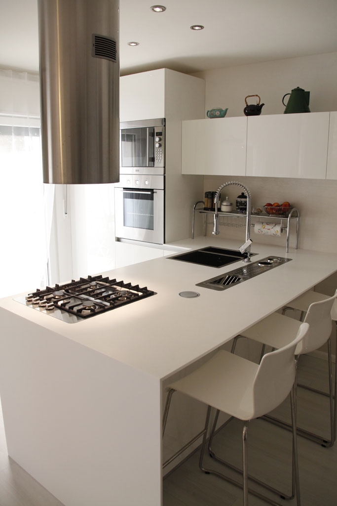 white kitchen shelves with black countertops